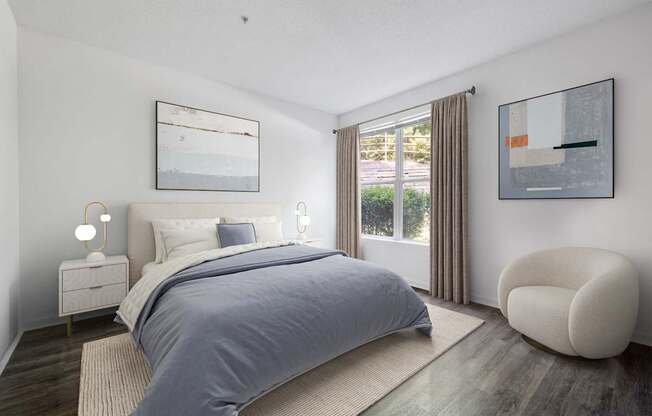 A bedroom with a large bed and a chair.