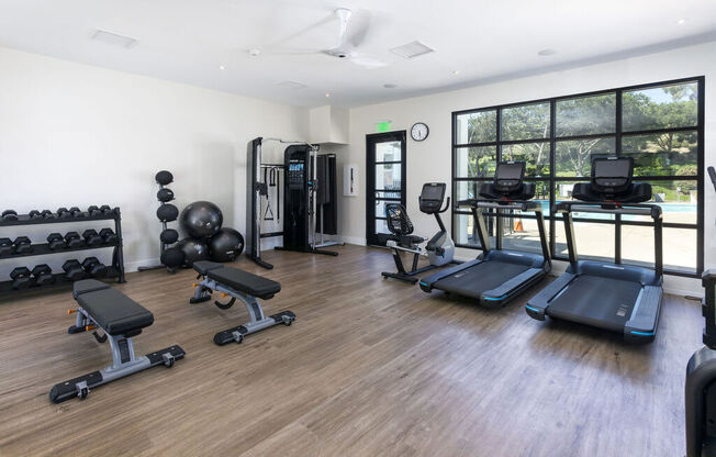 the gym is equipped with weights and cardio equipment at La Jolla Blue, San Diego, CA 92122