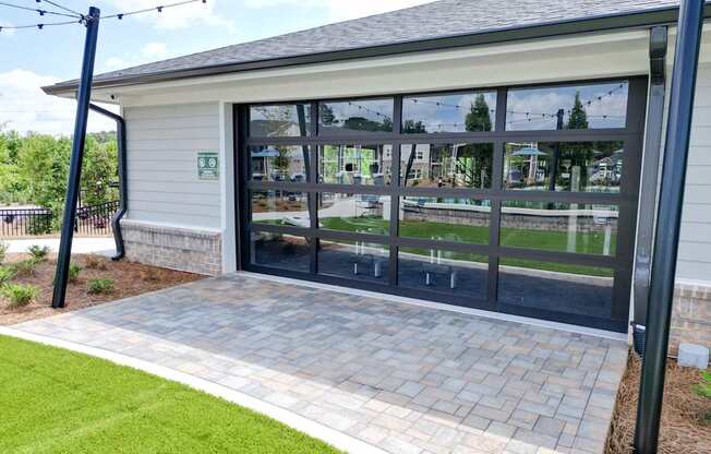 A building with a glass door and a sign on the wall.