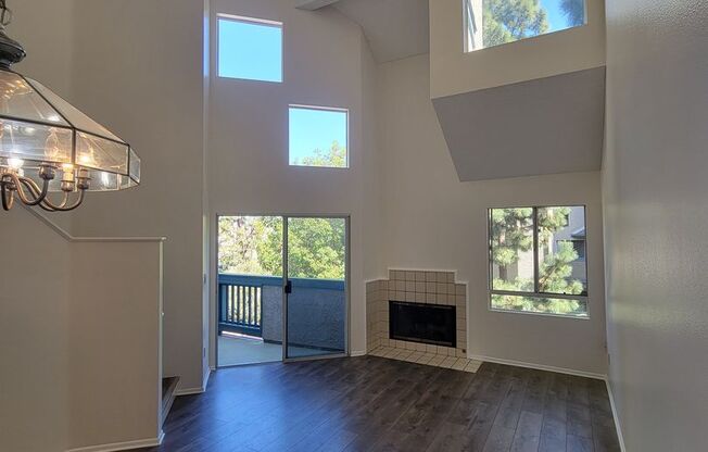 Top Floor Penthouse Loft Condo | Fireplace | Laminate Flooring | Community Swimming Pool
