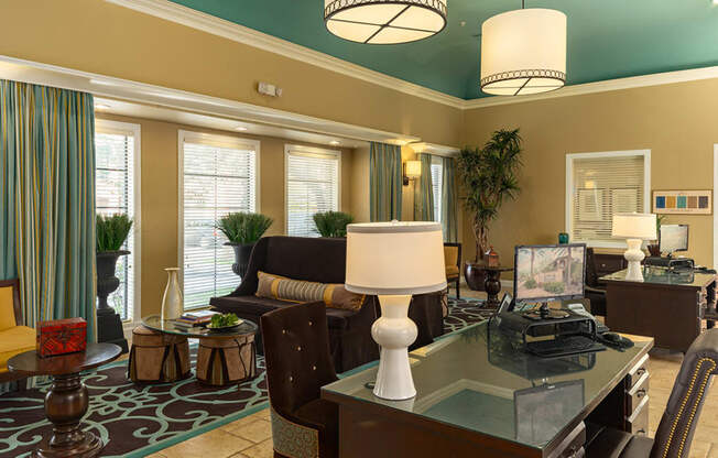 a living room filled with furniture and a large window