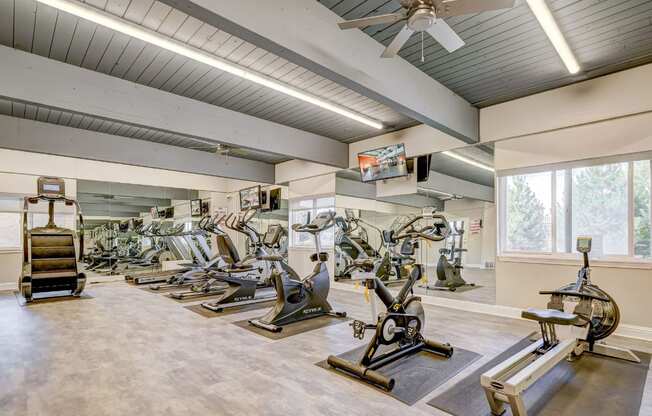A spacious gym with a variety of exercise equipment.