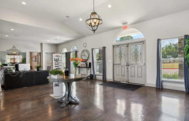 a living room with white walls and a table