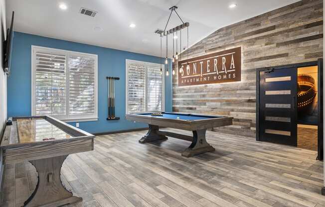 a game room with a pool table and a billiards