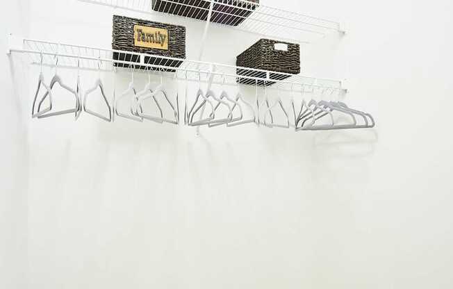 A wall with wire shelves on it.