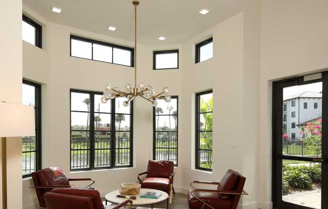 Beautiful ceiling lights in modern living room with dining at Azola West Palm Beach, West Palm Beach, FL, 33411