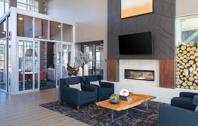 A modern living room with a fireplace and a flat screen TV.