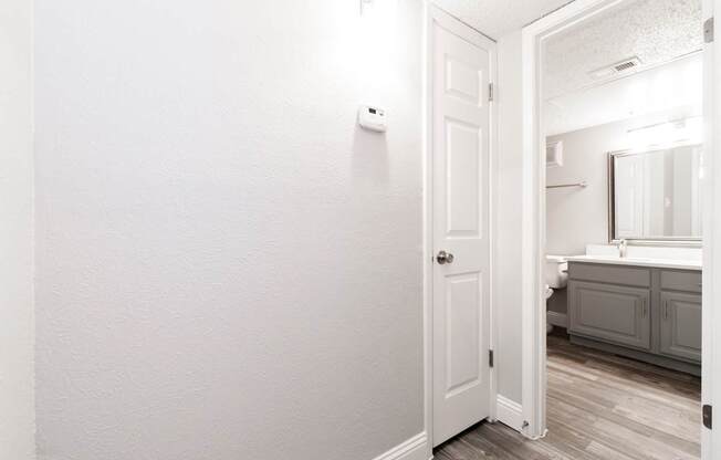A2 upgraded apartment bathroom entrance with towel closet at Vine Apartments in Arlington, TX