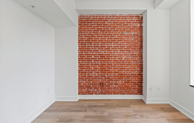 Experience urban elegance with this stylish exposed brick feature.