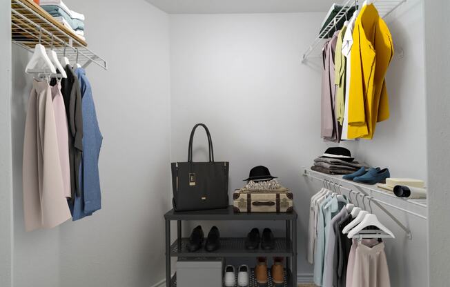 a closet with a rack of clothes and a bag