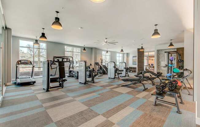 A gym with a variety of exercise equipment.