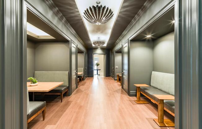 Library with private alcove seating, built-in benches, and refined lighting creating quiet spaces for work, or focused downtime.