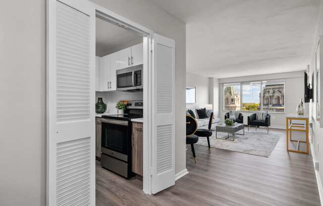 a kitchen and living room in a 555 waverly unit