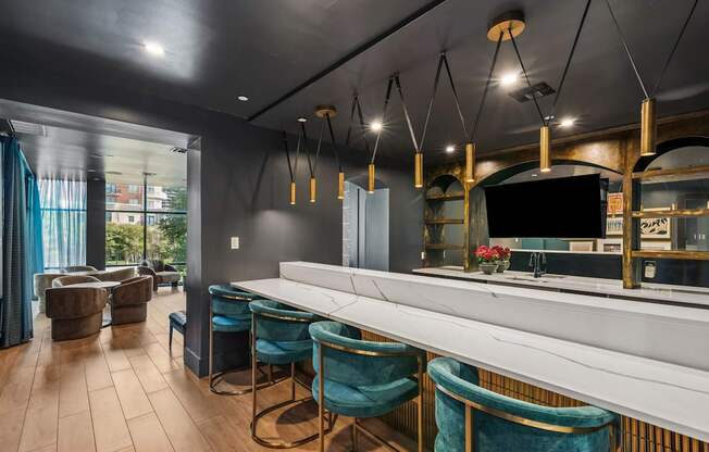 A room with a bar and chairs.