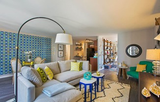 a living room with a couch and tables