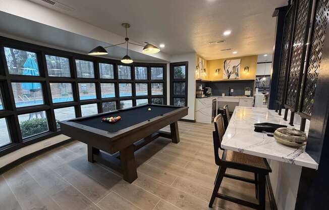 Resident clubhouse at Remington Place Apartments in Raleigh, NC featuring pool table