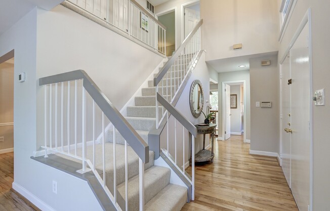 Coveted end-unit townhome in Inverness North. 2-story foyer, finished basement, private patio