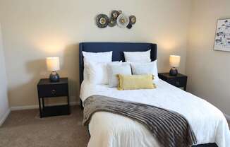 View of the bedroom in the model home at Harbour Breeze Apartments in Suffolk Virginia