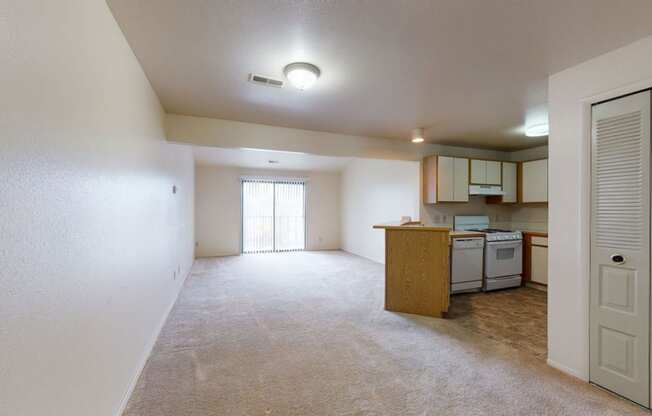 large living/dining areas and kitchen with breakfast bar