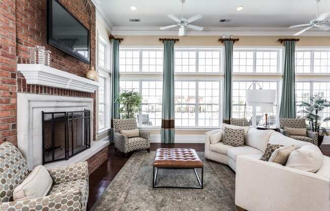a living room with a brick fireplace and a couch and a coffee table