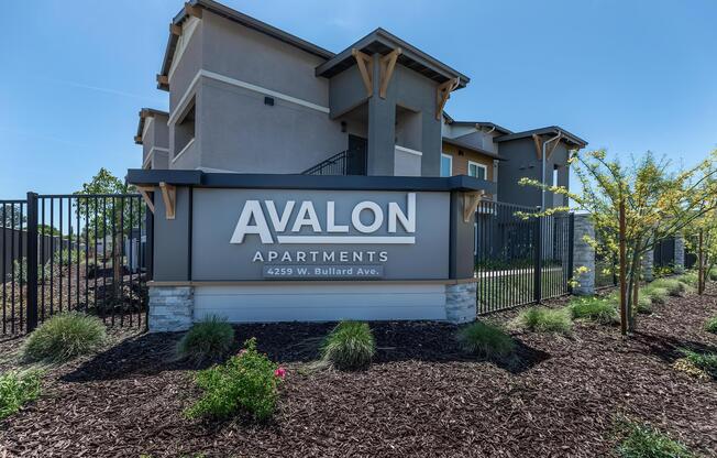a house that has a sign on the side of a building
