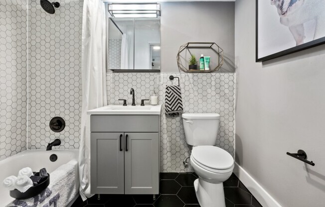Designer bathroom with elegant all-white bath