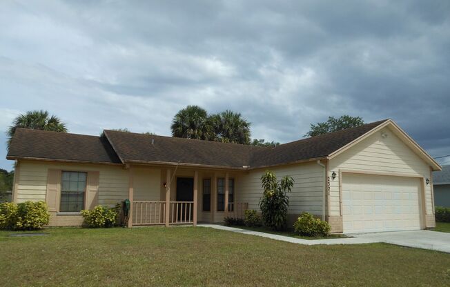 3 BEDROOM, 2 BATH CANAL FRONT HOME CONVENIENTLY LOCATED IN PORT ST LUCIE WITH A FENCED BACKED YARD, TILE & LAMINATE THROUGHOUT!