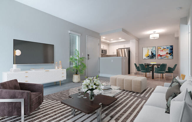 a living room with blue walls and a large tv on the wall  at Laguna Gardens Apts., California