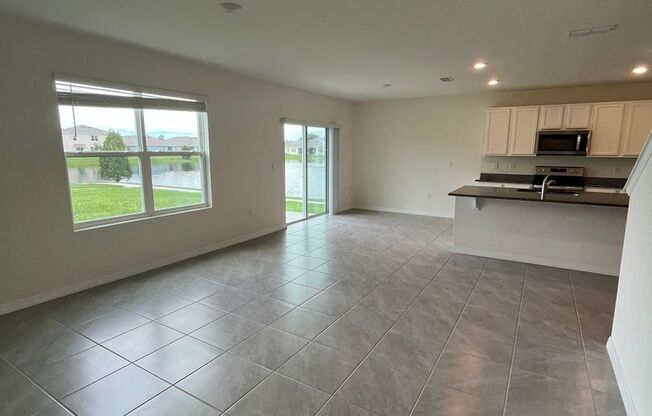 Amazing 5 bedroom 3 bath newly built home near Lake Nona with water views and room for everyone!