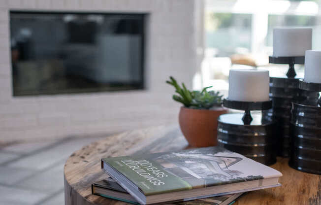 a stack of magazines sitting on a table in a living room