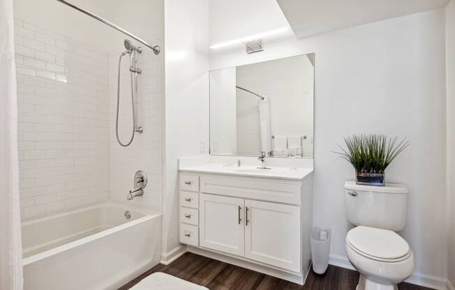 a bathroom with a toilet sink and bathtub at Metro 303, New York