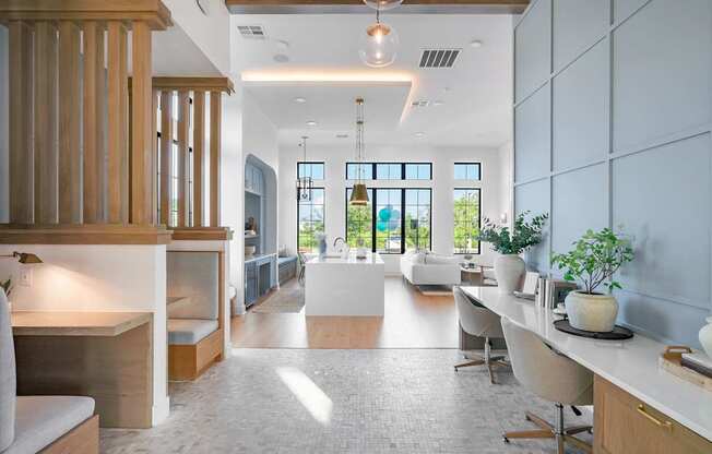 A modern kitchen with a dining area and a living room.