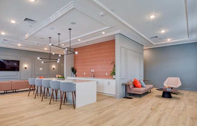 a living room with a kitchen and a dining room at The Bella at Westchester, Midlothian, VA, 23113