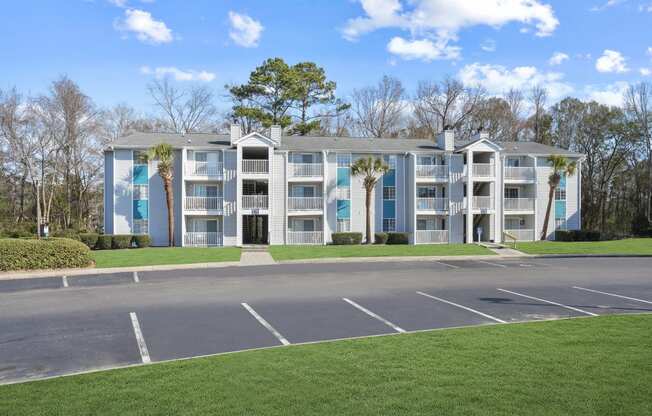 Apartment building with a parking lot in front of it  at Cape Landing, Myrtle Beach, 29588