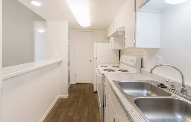 This is a photo of the kitchen of the 1007 square foot 2 bedroom, 2 bathroom apartment at The Biltmore Apartments in Dallas, TX.