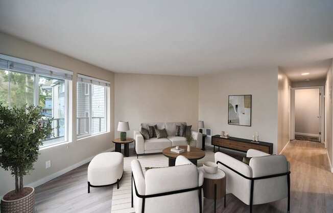 Bright living room with large windows at 3030 Lake City Apartments, offering modern comfort in Lake City, Seattle
