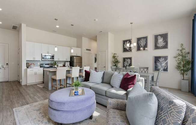 an open living room and kitchen with a couch and a table