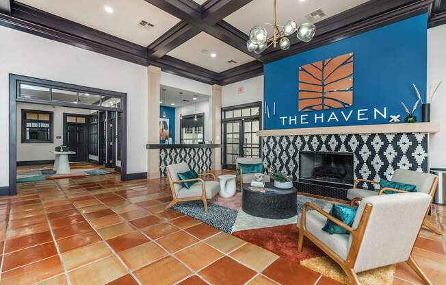 A living room with a fireplace and a sign that says "The Haven.".