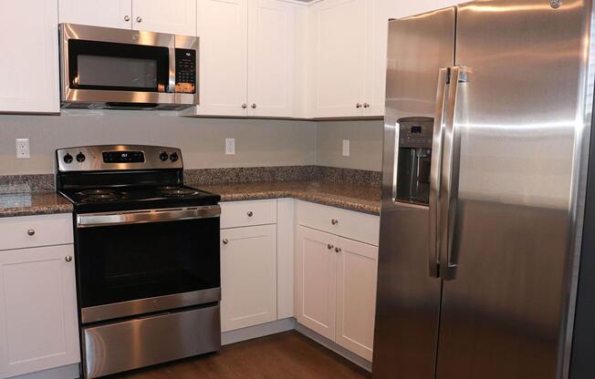 a kitchen with a stove top oven sitting inside of a refrigerator