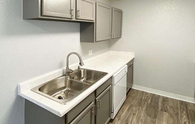 a kitchen with a sink and a microwave