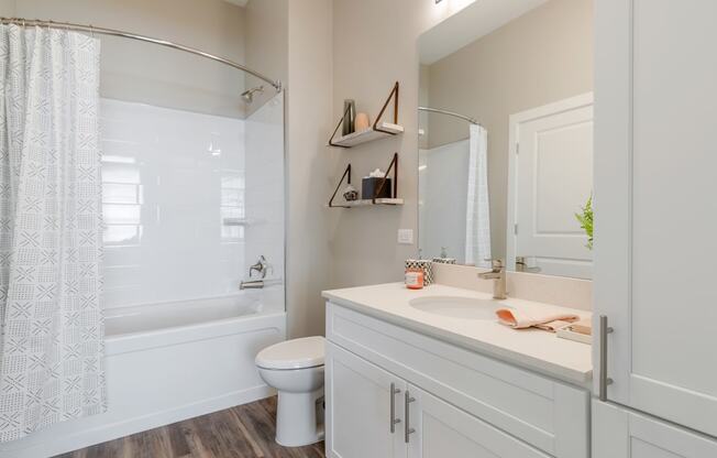 The Airdrie at Paoli Station bathroom with soaking tub and curved shower rod