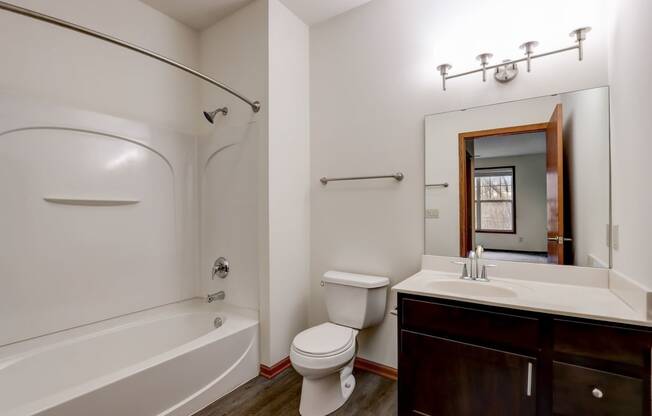 a bathroom with a sink toilet and a bath tub