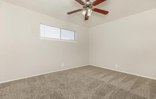 unfurnished bedroom with a ceiling fan