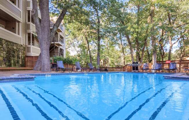 pool with trees  at Creekview Apartment Homes, Dallas, 75254