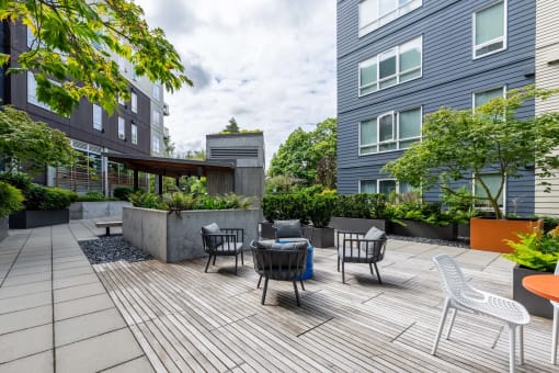 a patio with chairs and a table on a