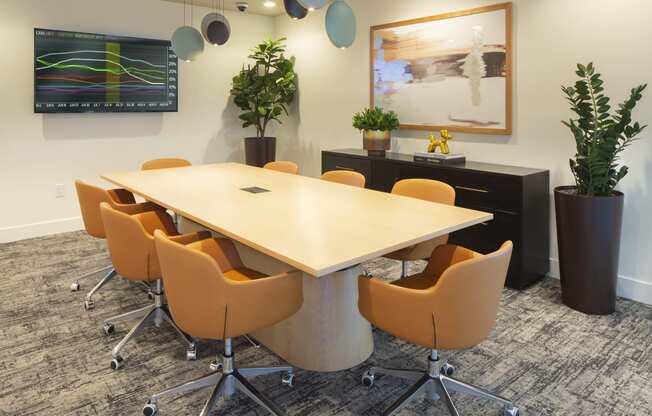 an empty conference room with a table and chairs