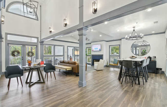 A modern living room with a dining area and a television.