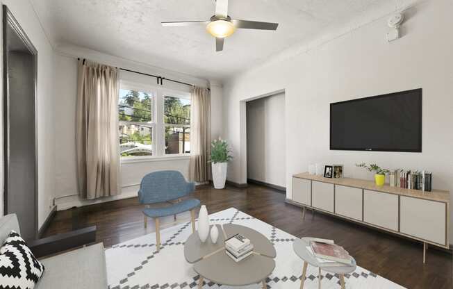 a living room with a large window and a ceiling fan at Del Mor Apartments, Los Angeles, CA, 90026