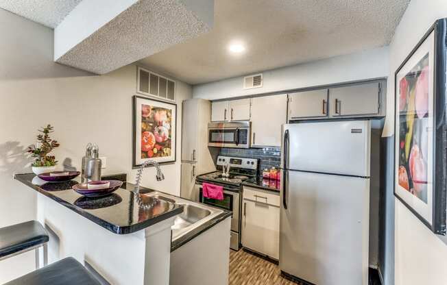 our spacious kitchen with stainless steel appliances and granite counter tops