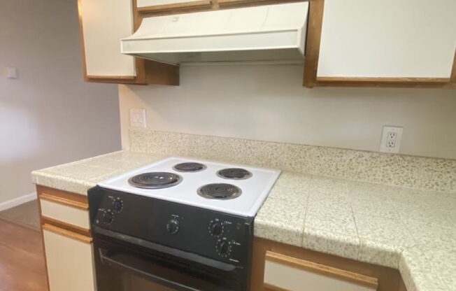 Brittany House 480 Boynton Avenue  San Jose, CA 95117 Kitchen with a black and white stove